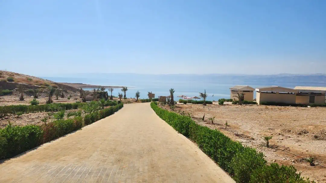 Walking toward the Dead Sea beach. The land on the other side of the sea is West Bank